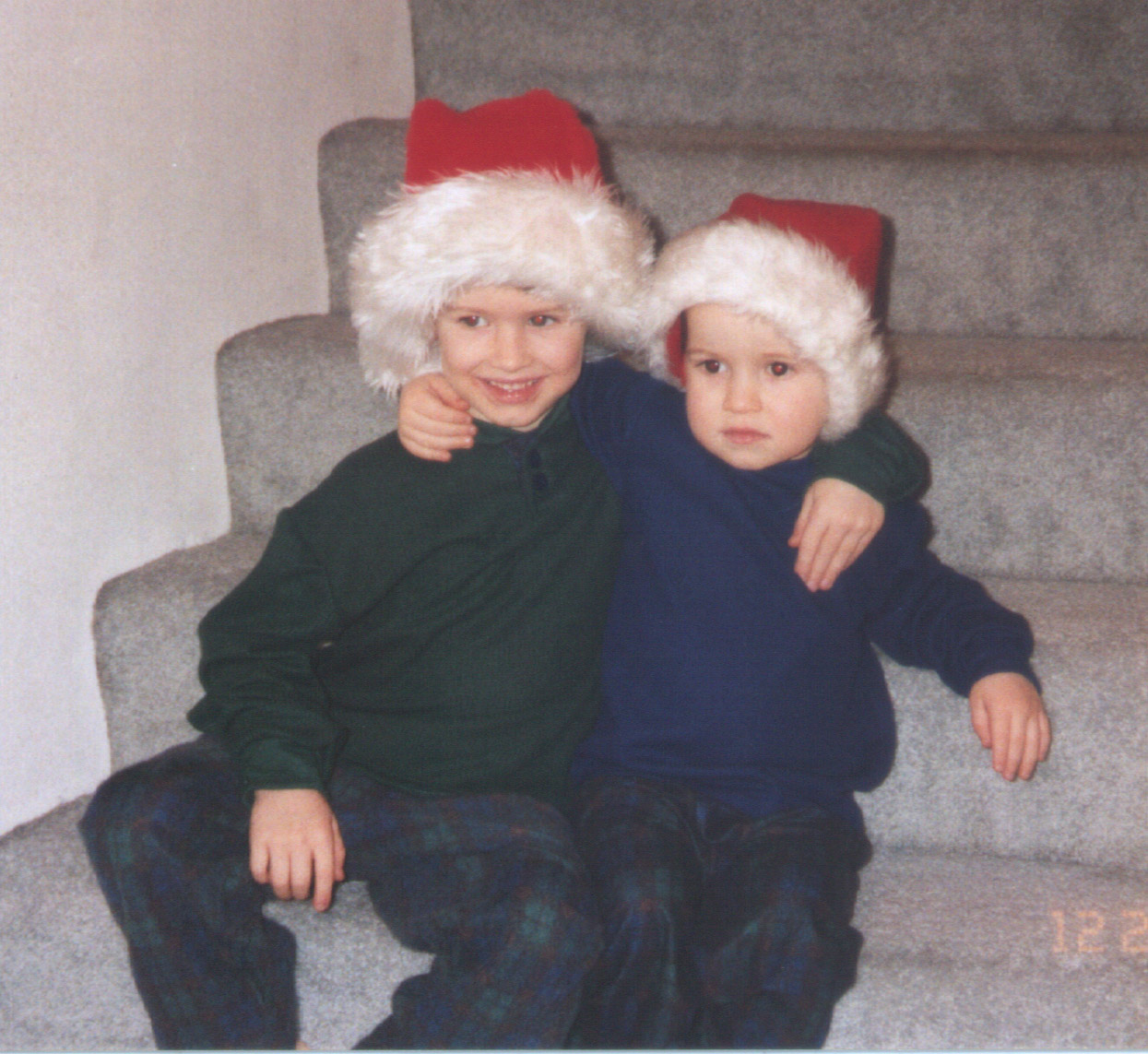 Boys in Santa hats on Stairs
